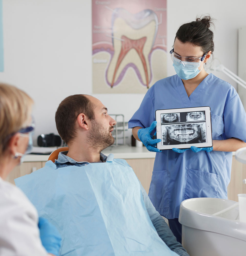 periodontal dentist showing ipad xray
