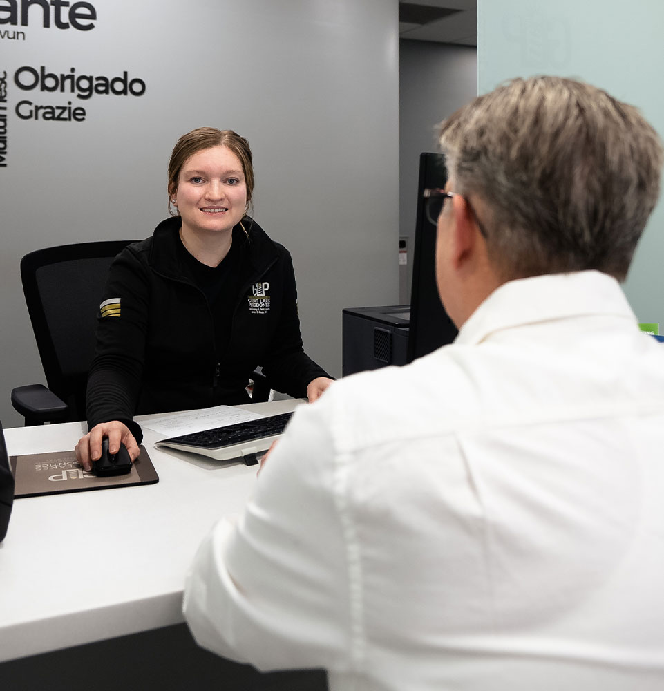 staff member helping patient go over dental finance options