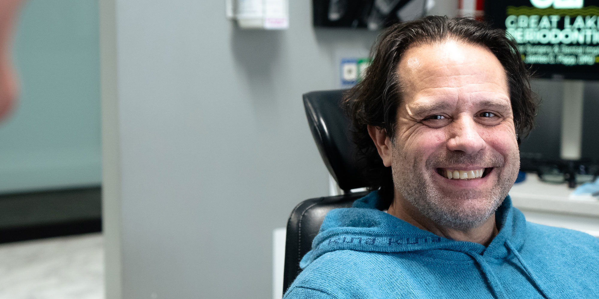 patient smiling brightly during their dental treatment