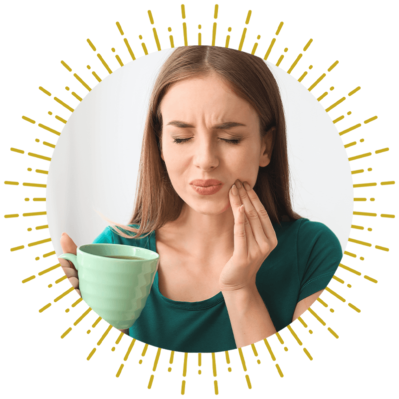 person that is having mouth pain while drinking a liquid