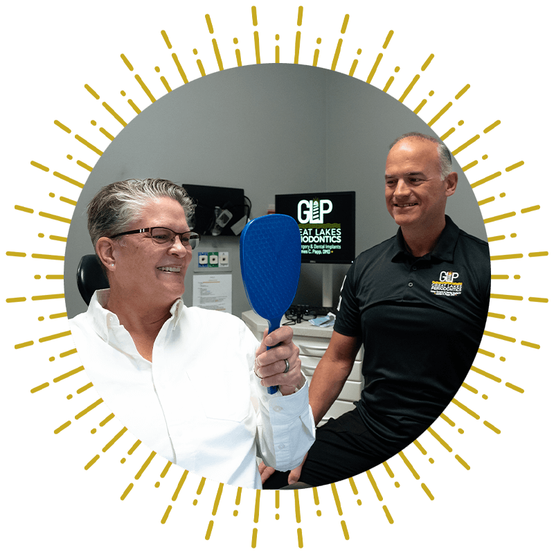 patient and doctor smiling brightly after their dental treatment