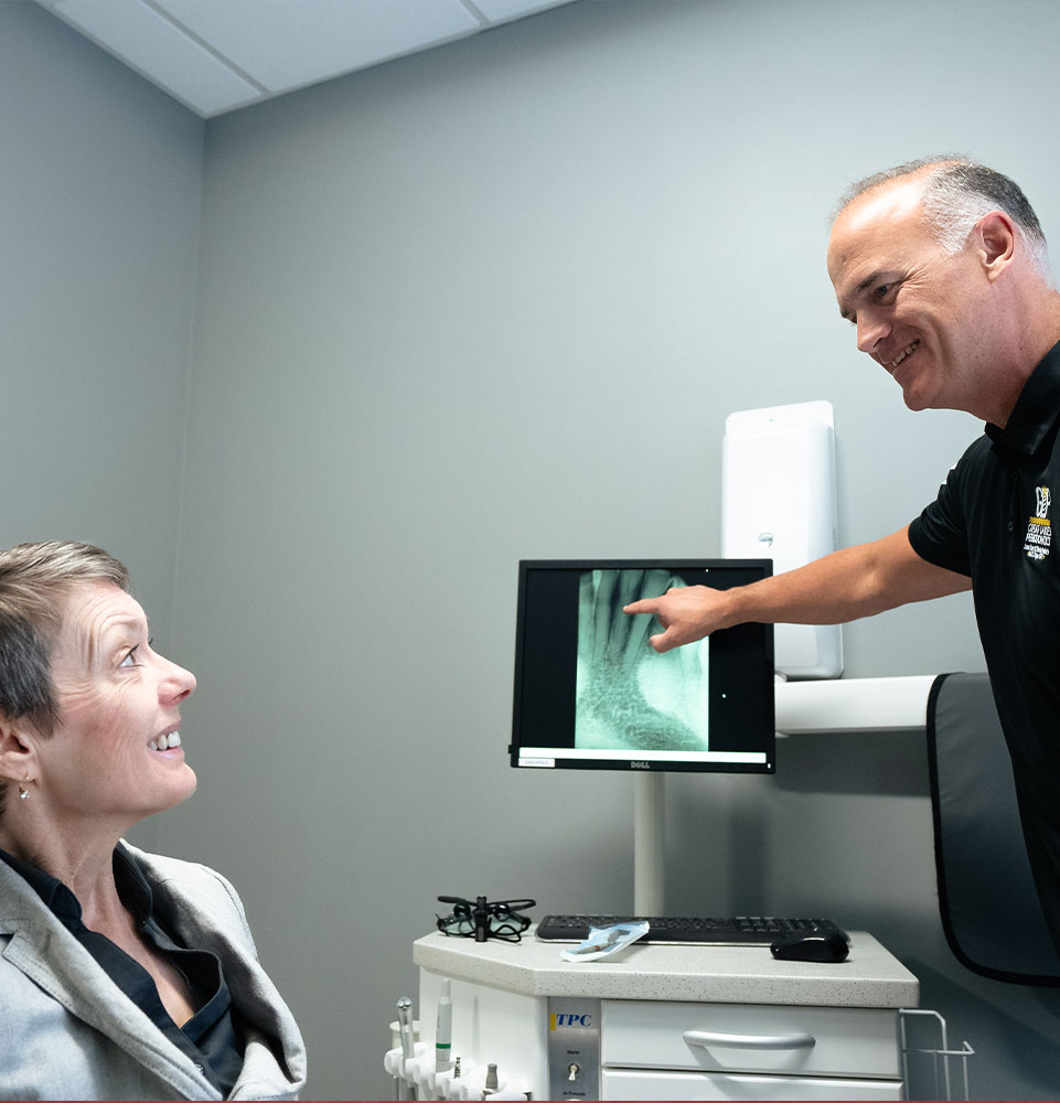 doctor and patient going over dental procedure information